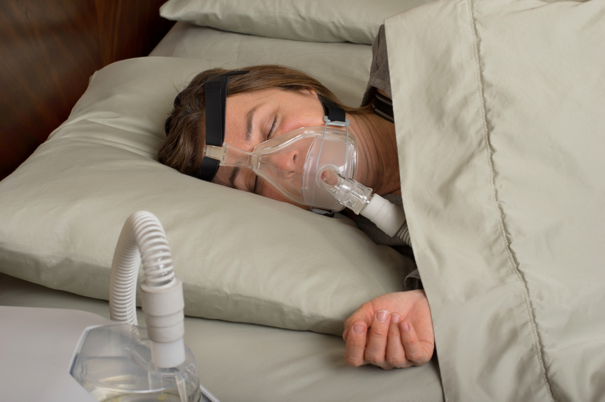 woman sleeping with CPAP
